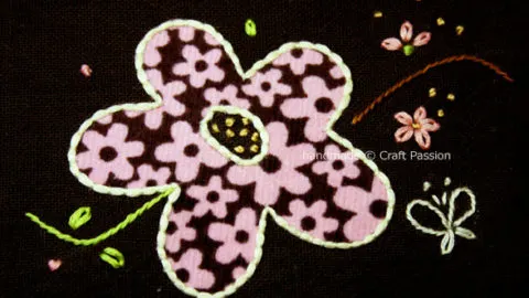 Free downloadable embroidery pattern for couching flower applique. Showing step by step picture on how to sew the couching stitch.