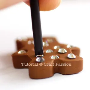 push rhinestone into polymer clay