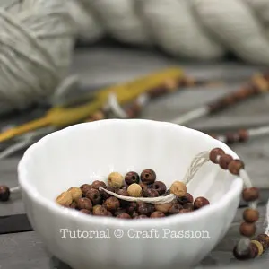 threading beads into yarn