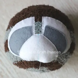 sewing sock raccoon face