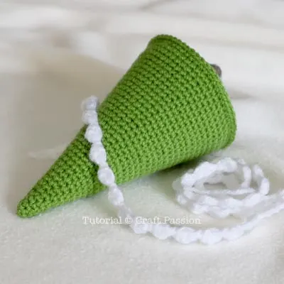 attach snow garland to pine tree