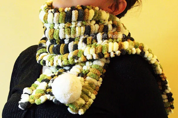 Learn how to knit a scarf that's super soft and warm with Pom Pom yarn. It is a quick project and you only need to know how to do the knit stitch.