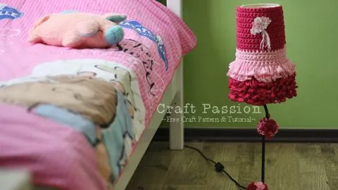 Transform the appearance of an outdated lamp by creating a stylish new crochet lampshade cover for it.