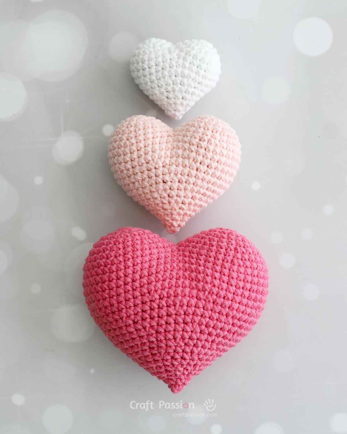 Finished puffy heart amigurumi in small medium and large sizes