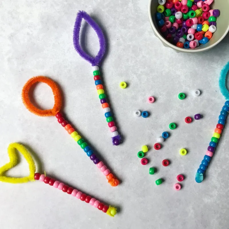 Make your own bubble wands using pipe cleaners. Dip them in soapy water and watch as bubbles float through the air, providing bubbly entertainment for kids of all ages.