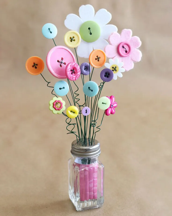This easy button bouquet craft is sure to brighten up any room you display it in! Gather buttons of different shapes, colors and sizes from the dollar store and attach them to wires poked through the holes of a salt shaker with foam or felt inside. This craft would be perfect for spring decoration or as a Mother&rsquo;s Day gift.