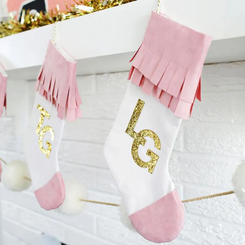 Boho-fy your holidays with this easy stocking design by A Beautiful Mess. You can personalize it however you see fit and even add your family member&rsquo;s names or initials onto them. This easy project will have you jingling all the way in style without breaking a sweat.