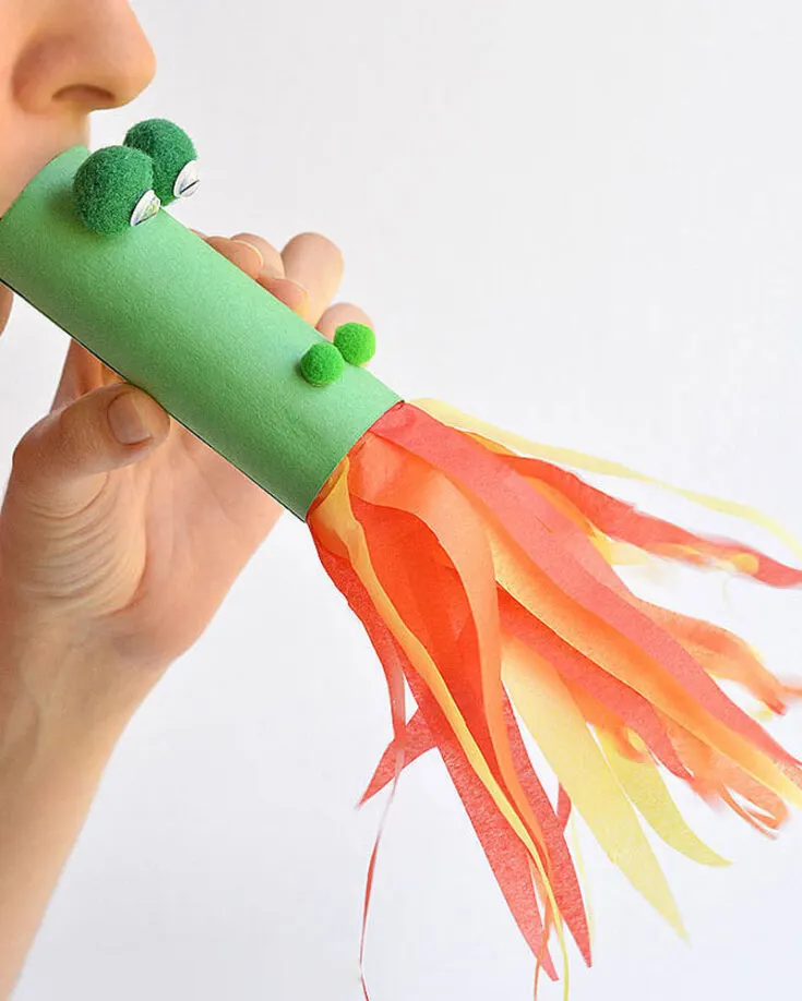 Your kids are going to love making this easy fire-breathing dragon craft that is made out of paper cores and craft tissue paper. This craft is pretty unique as it is functional. Watch as the flames come to life as you blow on the end of the tube!