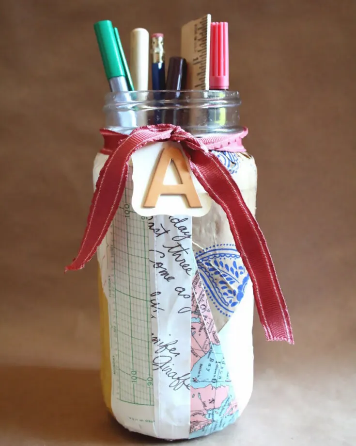 Use recycled paper, construction paper, printer paper, newspaper, or any paper. Cut them up however you like and paste pasting them to form the perfect mess- that is, this beautiful jar!