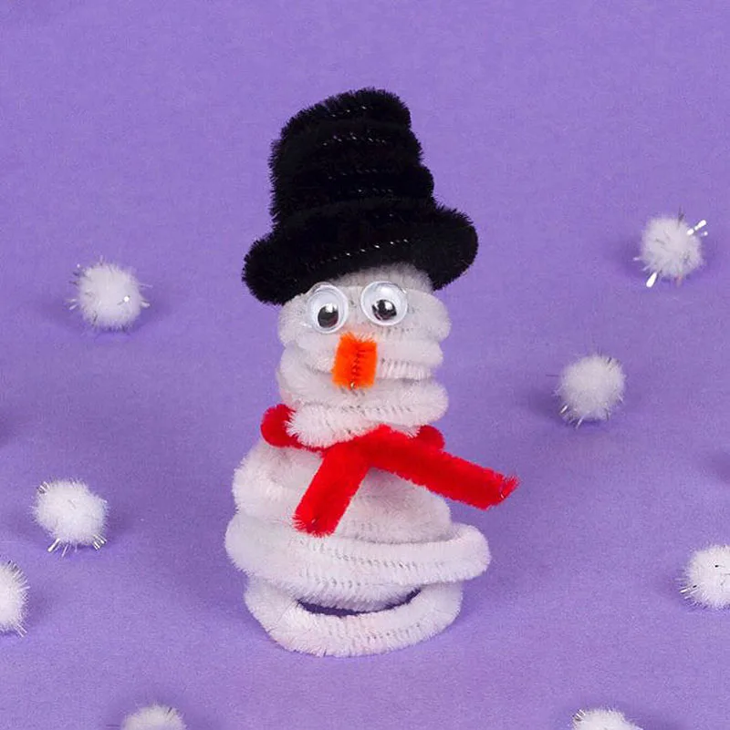Build a snowman indoors with pipe cleaners. Customize the size of your snowman by using less or more pipe cleaners. With his carrot nose and top hat, this charming craft is perfect for adding a festive touch to your holiday decor.