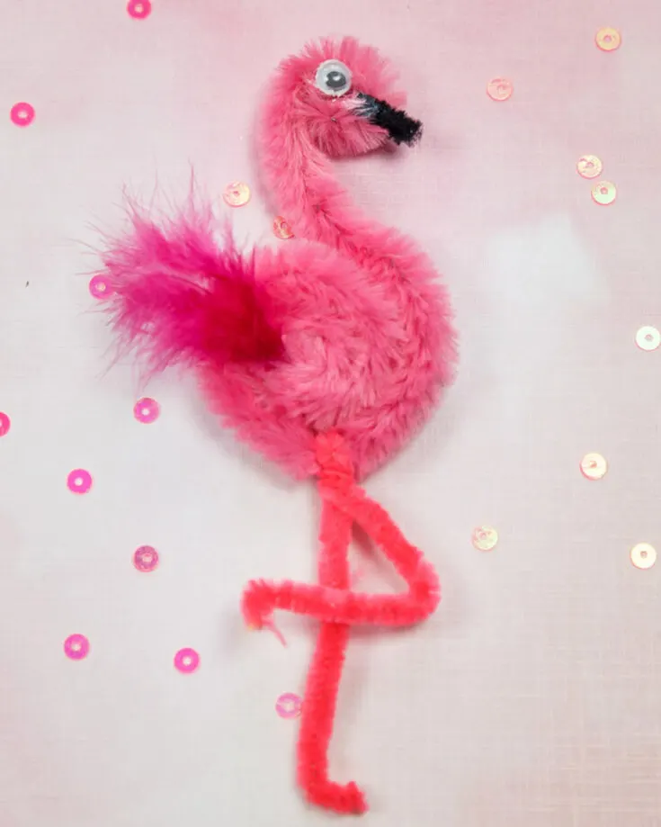 Get ready to make some adorable pink flamingo friends using pipe cleaners, faux feathers, and some googly eyes! All you need to do is twist and shape the pipe cleaners into a long neck and give it some skinny legs.