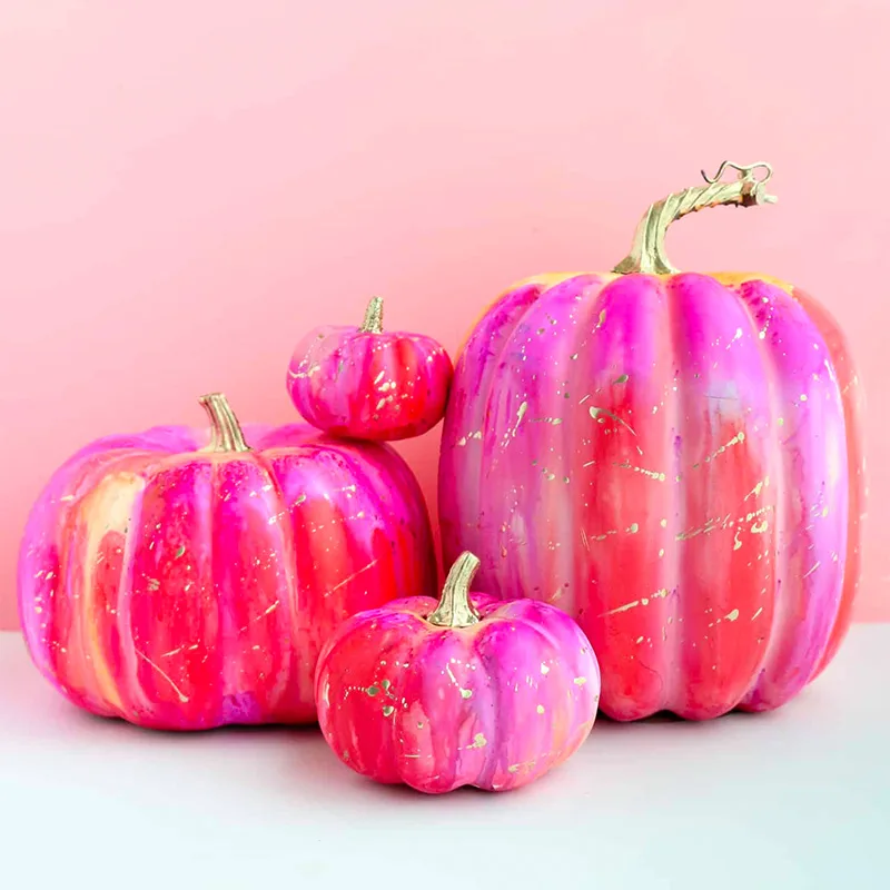 A cross between marbling and paint dripping, using alcohol ink on your painted pumpkin ideas will create the most beautiful results. These psychedelic pumpkins work best with fake pumpkins.