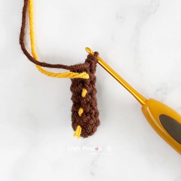 Step 1: Crochet the Tree Trunk

Start with brown yarn and make a magic ring. Crochet in continuous rounds to form a small cylinder for the trunk.