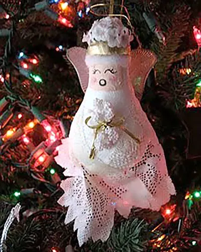 Get the beautiful DIY Light Bulb Christmas Ornaments tutorial here to make this angle ornaments for the Christmas Tree.