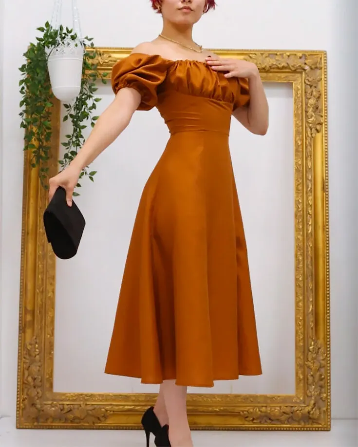 Check out this free Anthea Milkmaid Dress pattern! This cottage-core dress pattern is suitable for a myriad of occasions, from sweet picnic dates to an outdoor wedding celebration! This pattern could be adjusted for sizes between 0-32.