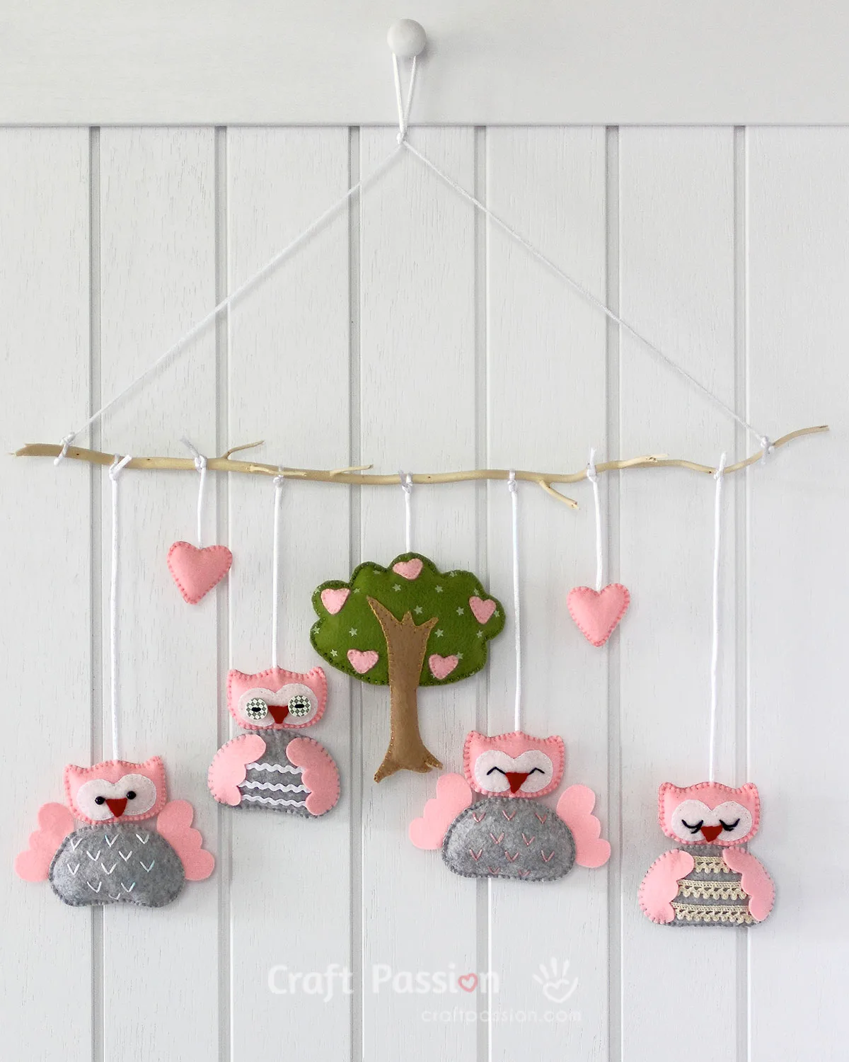 Create an adorable DIY baby mobile with our free sewing pattern featuring cute owl characters & a lovely tree design. Perfect nursery decor & baby shower gift!