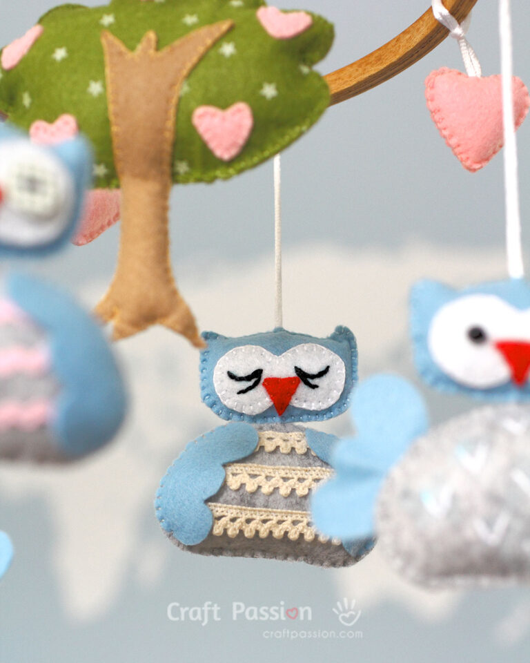 Create an adorable DIY baby mobile with our free sewing pattern featuring cute owl characters & a lovely tree design. Perfect nursery decor & baby shower gift!