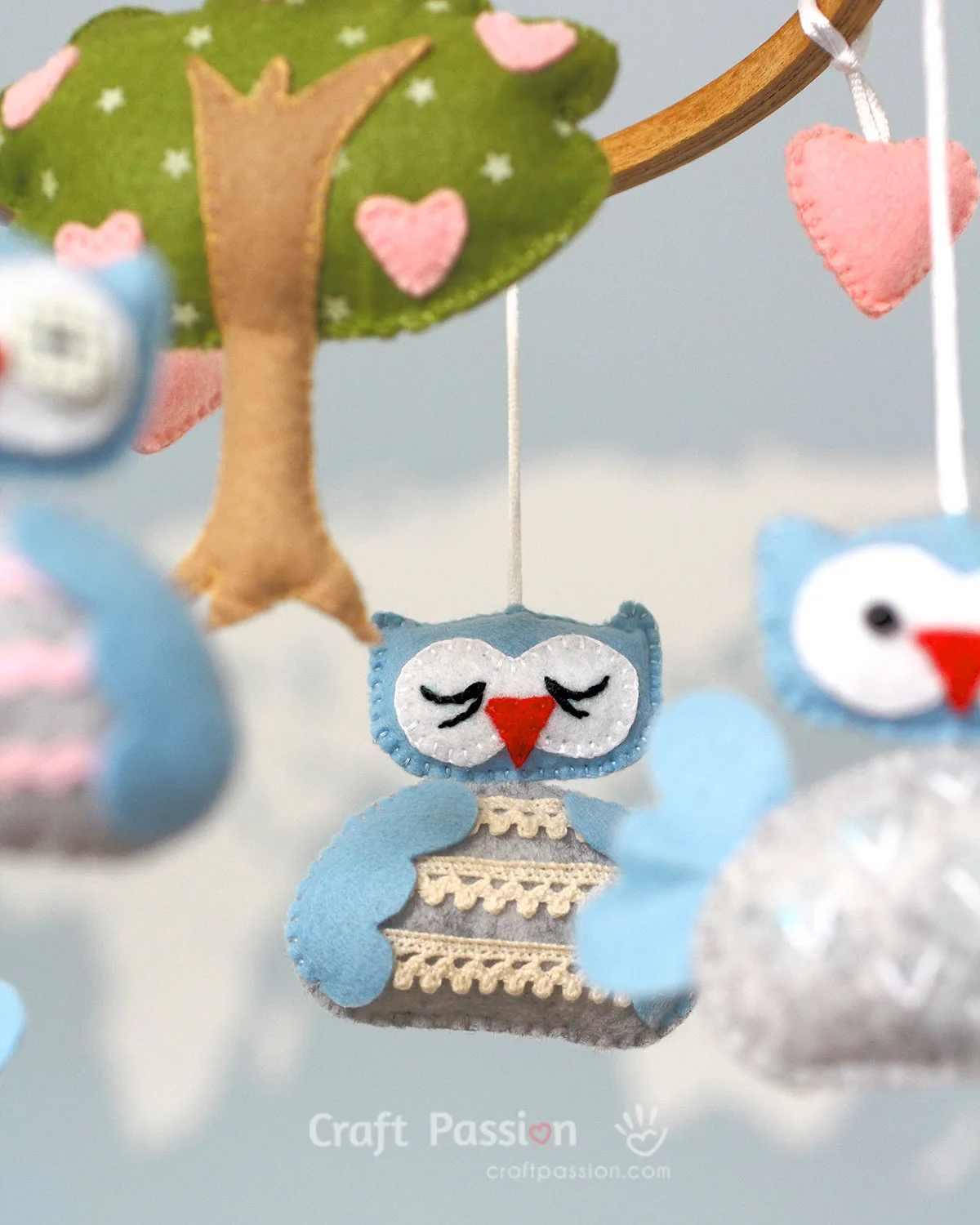 Create an adorable DIY baby mobile with our free sewing pattern featuring cute owl characters & a lovely tree design. Perfect nursery decor & baby shower gift!