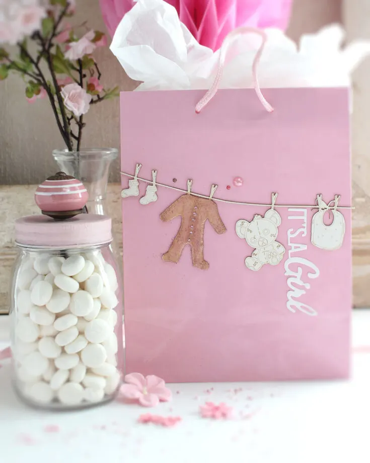 Make elegant baby shower gift bags for your guests with adorable embellishments, filled with sweet treats and thank you cards to show your appreciation as you celebrate this exciting journey into motherhood.
