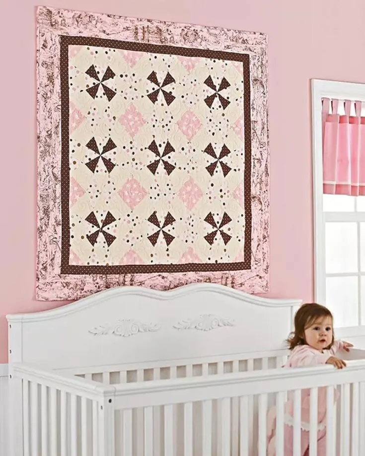 Check out this fantastic kaleidoscope baby quilt pattern! Isn&rsquo;t it gorgeous? It is the perfect design for your next quilting project, complete with polka dots, stars, and toile flannels that combine into a snuggly quilt in two colorways. The finished size is 47 &frac12;&rdquo; x 47 &frac12;&rdquo;.