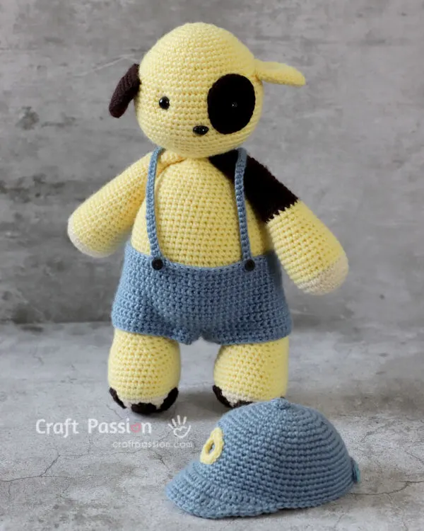 crochet dog with baseball cap and suspender pants