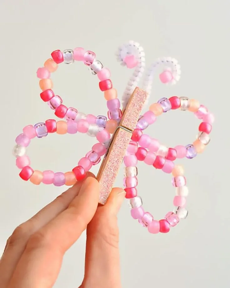 Wow! We can't get enough of these beautiful Pipe Cleaner Butterflies. Use a variety of bead colors to make personalized butterflies. It's a lovely, kid-friendly craft.