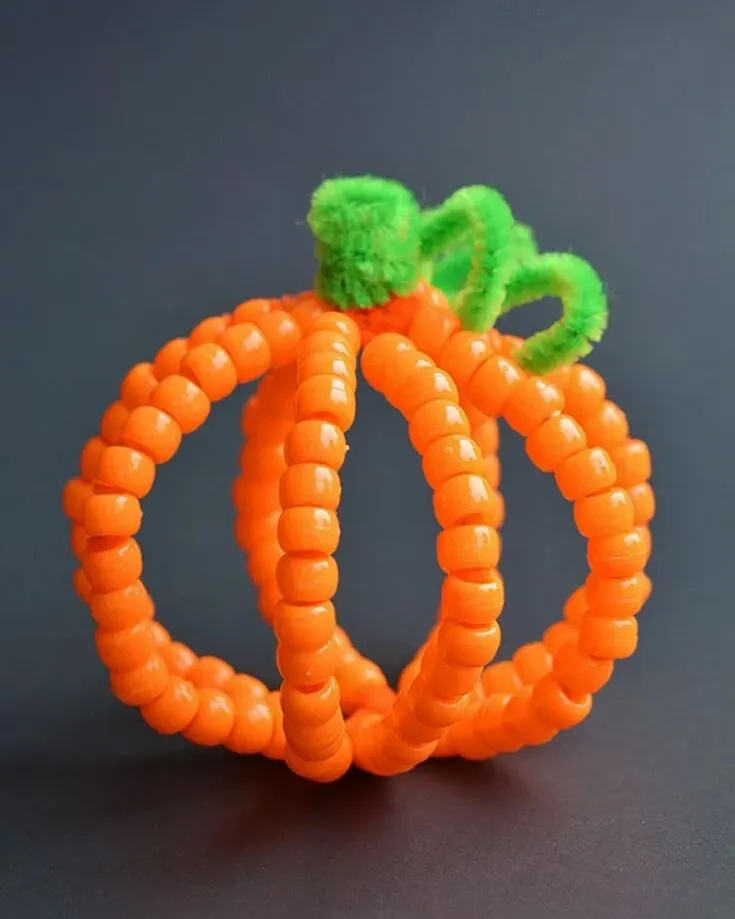 Check out these simple Halloween crafts for kids. Create a humble pumpkin patch to display on the countertop or your porch! Weave beads of different colors to make a whole family of them!