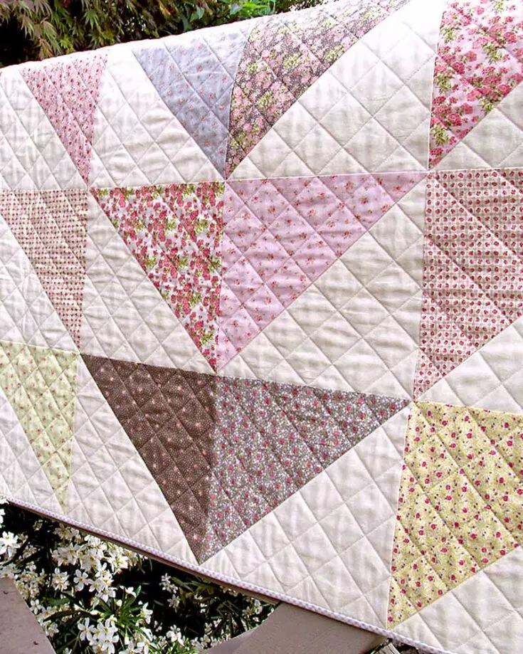 Bring the beauty of nature to your quilts with this Blooming Florals quilt pattern! It&rsquo;s the perfect design to quilt on a relaxing day at home, and this pattern blends soft yet vibrant colors using the half-square triangle (HST) method. It features angled corners and incorporates delicate floral colors and motifs to make the quilt stand out. The finished size measures a 54&rdquo; x 54&rdquo; throw quilt.