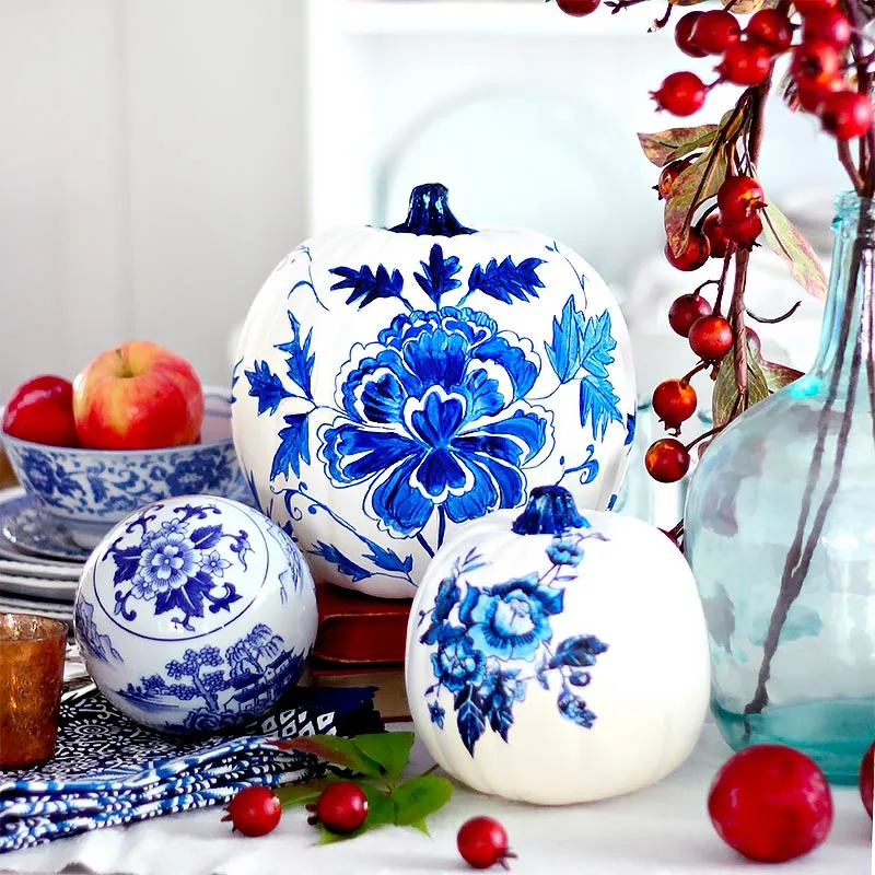 Aren't these blue porcelain pumpkin painting ideas gorgeous? The contrast of the fall colors with the blue makes this pumpkin stand in the limelight. It may take some time, but follow this tutorial thoroughly for breathtaking results.