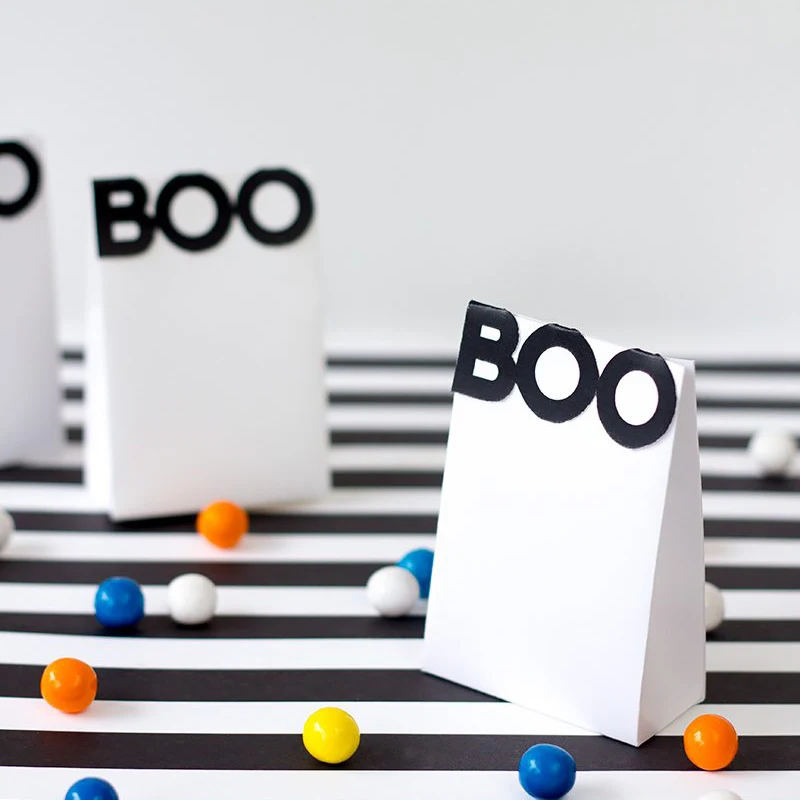 If you&rsquo;re going for a modern approach toward Halloween, these simple, black-and-white treat bags are just the thing! They&rsquo;re a breeze to put together. Print, cut, glue, and stuff with candy, and you&rsquo;ll have a chic party favor.