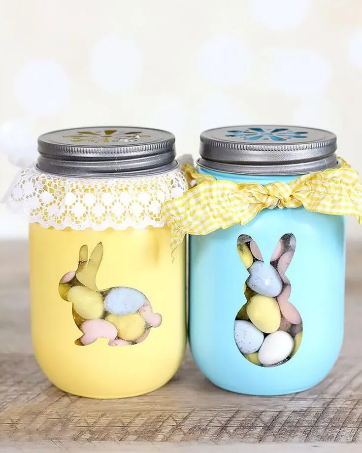 Looking for another Easter craft for kids? Well, this design is calling your name. If you want to recycle old mason jars, just repaint them with a bunny cut-out template and fill them up with a ton of candy!&nbsp;
