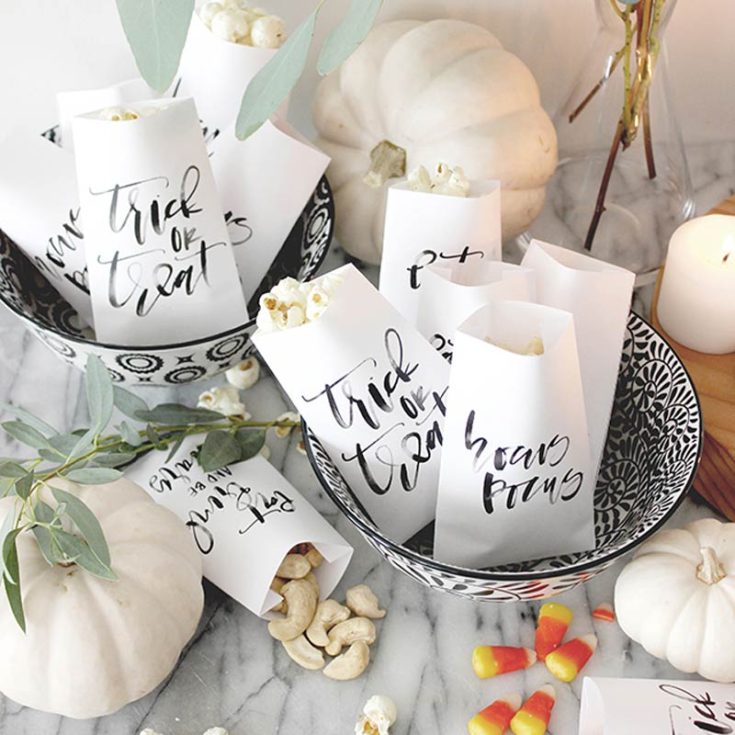 These printable calligraphy treat bags offer a more personal and elegant touch for your guests. These bags feature a sophisticated, simple design that stands out from the usual burst of Halloween colors, adding a classy and thoughtful element to your role as a hostess.