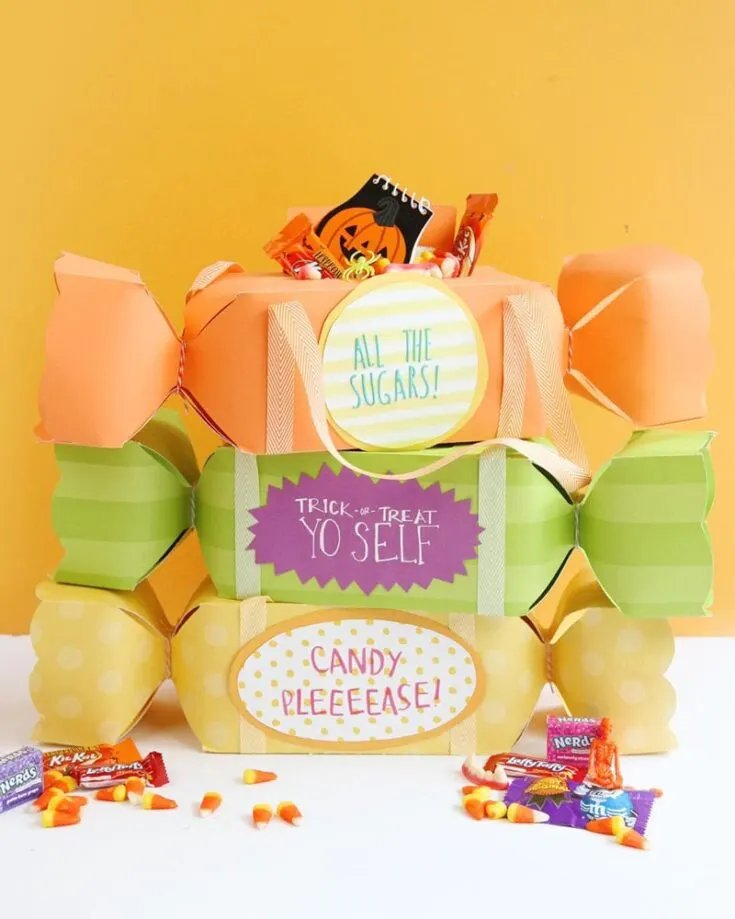 These candy-shaped trick-or-treat bags with ribbon straps are perfect for little ones to carry their sweets from door to door. These adorable bags make it easy for kids to store their candy. Stick on a cute Halloween phrase to personalize them and make the experience even more special!