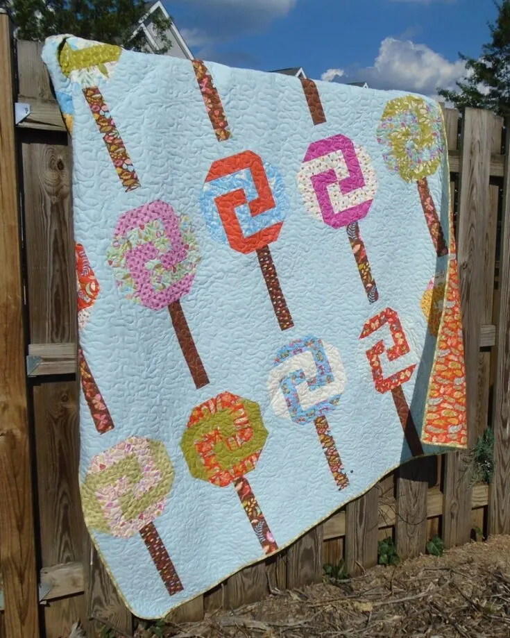 Check out these cutesy lollipop quilt designs. It's perfect for intermediate and advanced quilters to make this sweet treat. All you need to do is follow the step-by-step instructions, and you'll have a quilt that makes you fall into a deep, sweet slumber. The finished size is 68" x 78".