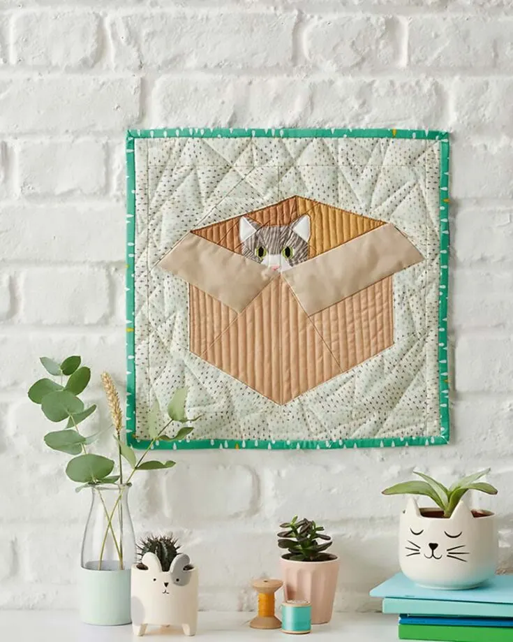 Try making the cutest kitty portrait you&rsquo;ve ever seen! It&rsquo;s a pattern fit for confident beginners, and it yields a 15 &frac12;&rdquo; x 15 &frac12;&rdquo; quilt, but you can always upsize it to fit your desired size. This fat quarter-friendly pattern also uses the foundation paper piecing technique to create the kitty&rsquo;s sweet face and green eyes.