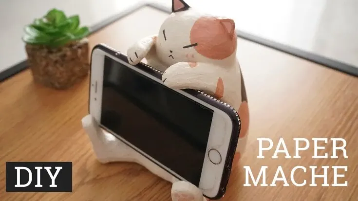 The paper mache cat phone holder is an adorable and functional craft. Just follow along with the video and you can whip up some for your friends and family.