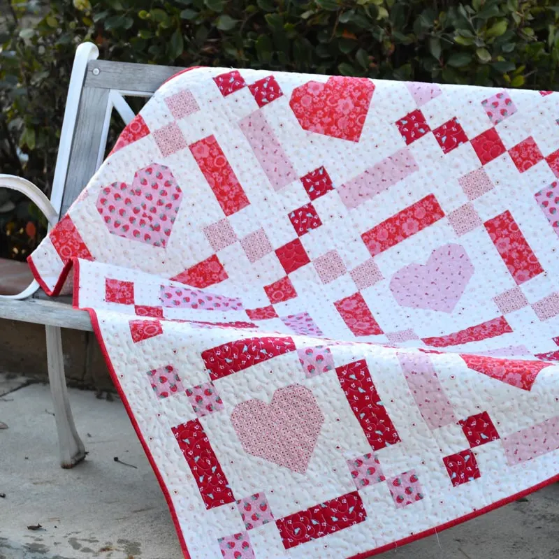 Whether you're making it for your partner, your mom, or Valentine's Day, this quilt will have you falling head over heels! It's such a gorgeous and lovely design that is made from 5 fat quarters. The finished size is 50" x 50", with an Irish chain style and pieced hearts in the center. Isn't it adorable?&nbsp;