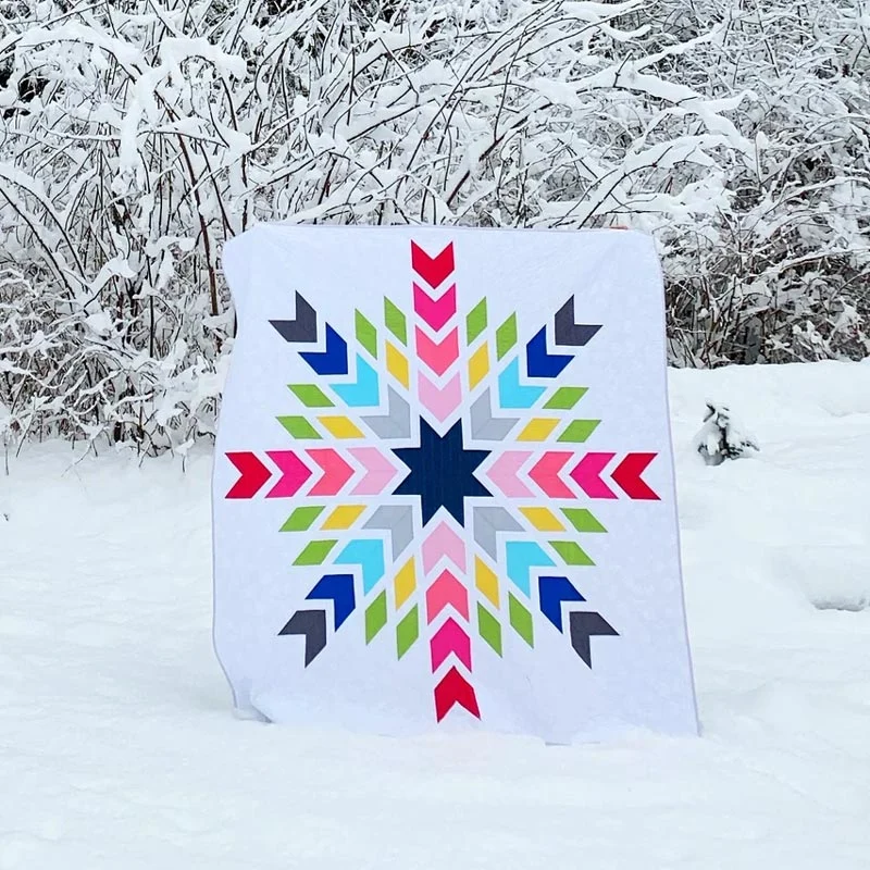 Want to quilt a cozy blanket to bring along to your cabin getaways? Try this beautiful Chevron Snowflake quilt design that is ideal for all quilters. It offers a delightful mix of classic chevron designs and intricate snowflake motifs for only $4.95. Get cozied up by creating this stunning quilt that captures the serene elegance of falling snow. The finished size is 80&rdquo; x 80&rdquo;.