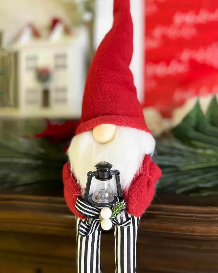 The Christmas Shelf Sitter Gnome with legs is a delightful addition to your holiday decor. Who knows, this simple sock gnome might just become a beloved generational Christmas heirloom!