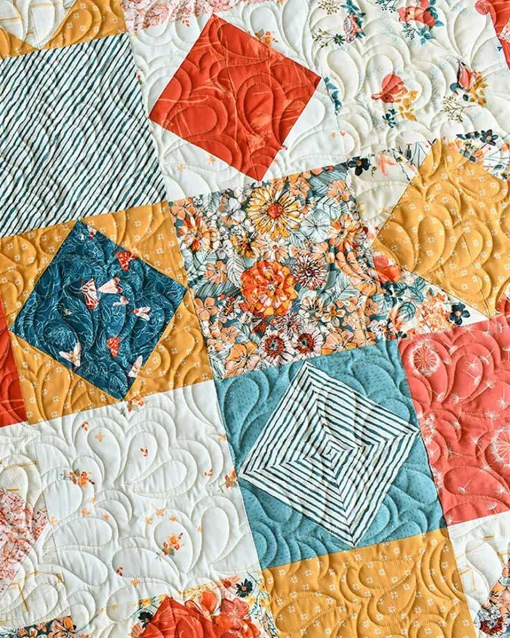 Quilt this gorgeous and simple Clustered Gems layer cake pattern that can be made in 5 quilt sizes: baby, throw, twin, queen, and king! This charming design combines the elegance of gemstone-inspired fabric squares with a straightforward piecing technique. It&rsquo;s a great project for quilters of all skill levels.