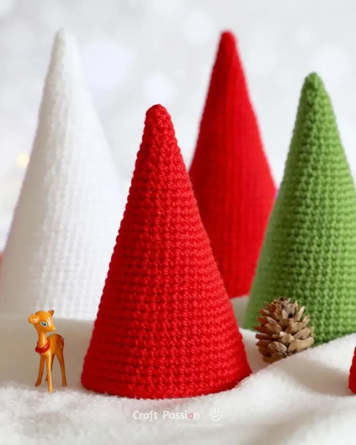 Get ready to add some festive fun with these colorful Cone Trees! You can crochet them with yarn and customize their heights by simply adjusting the number of rounds. They&rsquo;re super easy to create, and we&rsquo;ve got a handy pattern to guide you along. Let your creativity shine and bring these vibrant trees to life!