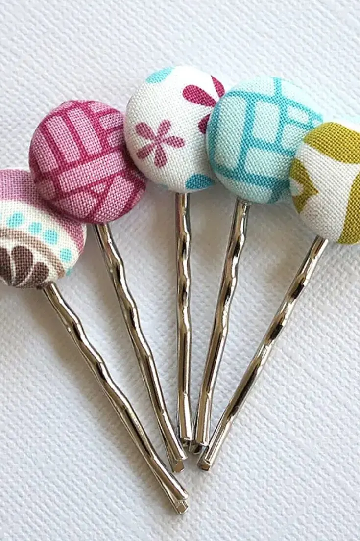 This cute craft can quickly use up your scraps that are too small to be used elsewhere. Using a covered button kit and some bobby pins with glue pads, this is such a fun and easy craft to do.