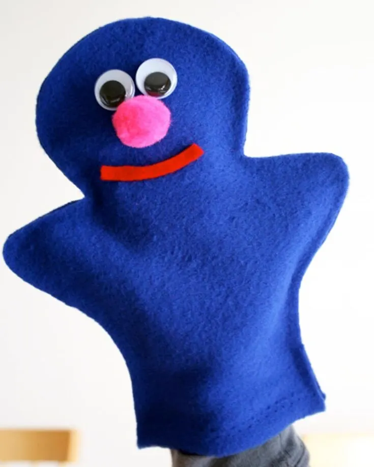 Here's a quirky Sesame Street-inspired puppet called Grover! Isn't he adorable? With just some felt or fleece, you can glue the parts of Grover together, and your kids will adore this fun little companion for bedtime stories.