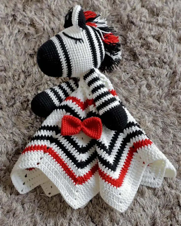 First on the list is our beautiful Zebra Crochet Lovey pattern that is to die for! It's soft on your little ones' skin and perfect to snuggle with. It's precisely 23" from point to point, and the Zebra's head is 4" wide. Skill Level: Avid beginners Yarn Weight: Worsted #4 Major Stitches: SC, DC, HDC