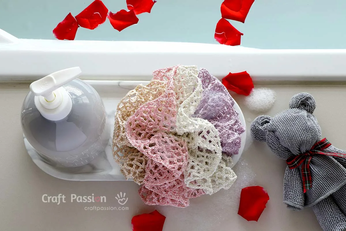 DIY your own shower scrubbie with this easy, beginner-friendly crochet loofah pattern. Great as a washcloth or bath pouf for everyday use or gifts!