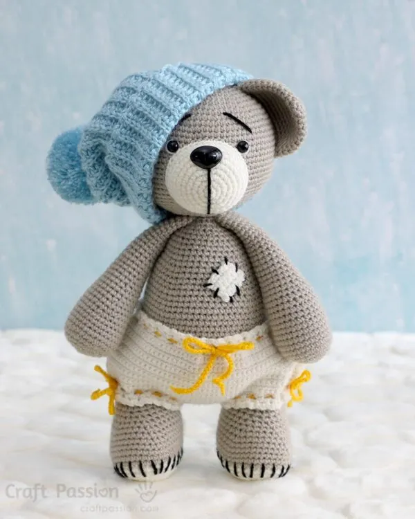 free crochet teddy bear pattern in bloomer pants and beanie hat.