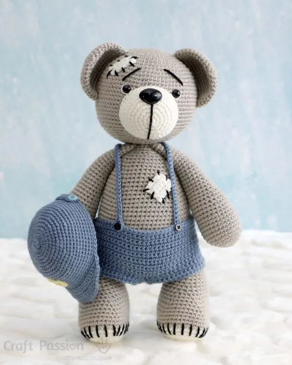 free teddy bear crochet pattern wearing a suspender pants and a baseball cap