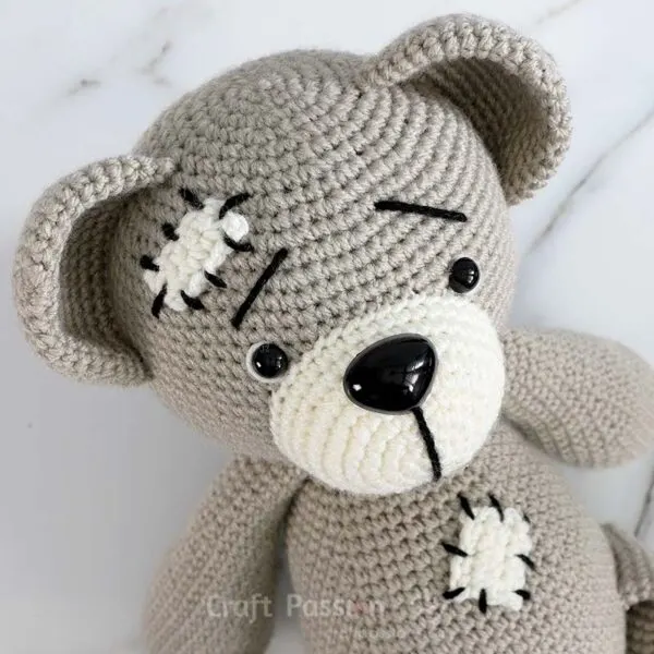 crochet teddy bear with mending patches