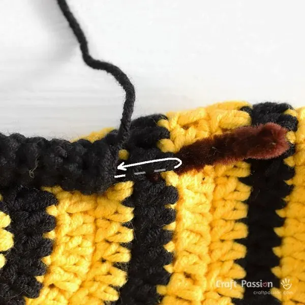 attach bee antennae with pipe cleaner in it to the crochet hat.