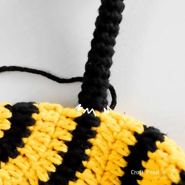 attach bee antennae to the crochet hat.